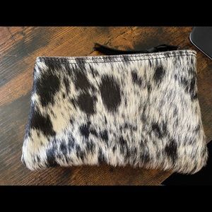 Black and white hair on hide pouch